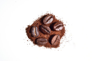 coffee beans with coffee power isolated on white background, clipping path