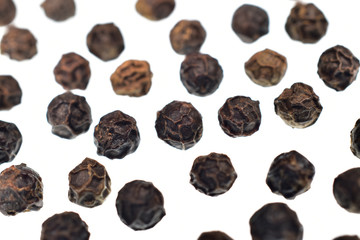 close up of black pepper or Kali mirch isolated on white background