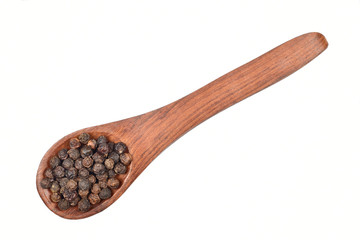 black pepper seeds in wooden spoon isolated on white background