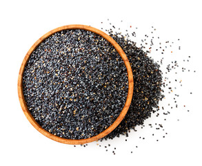 Poppy seeds in a wooden plate close-up view from above. Isolated