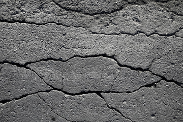 asphalt in cracks texture / abstract background cracks on asphalt road