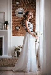 Fototapeta premium Beautiful bride with stylish make-up in white dress