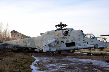 old broken military helicopter without blades and glasses