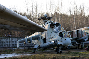 old broken military helicopter without blades and glasses