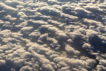 Blanket of clouds. Sun going below a blanket of clouds. On top of a blanket of clouds. Sun going below a blanket of clouds. Smooth view from above with a blanket of clouds.