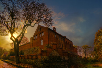 castle on the background of the setting sun