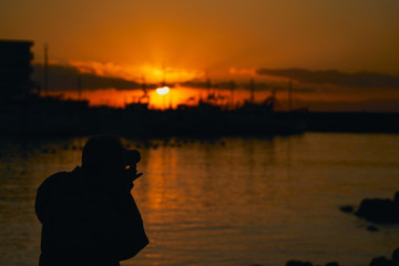夕焼けの漁港 撮影者