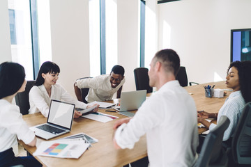 Office coworkers smiling during meeting