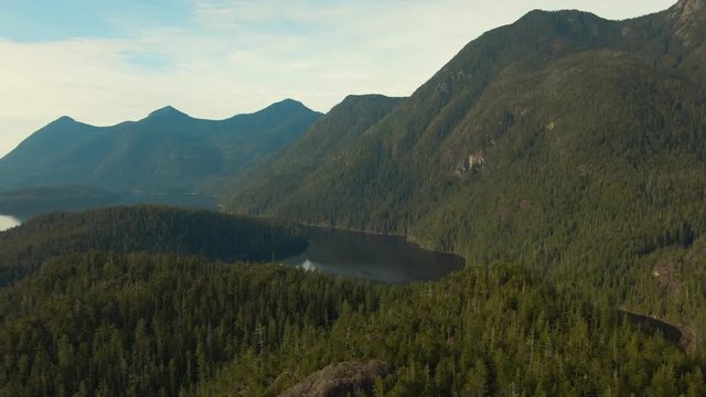 Beautiful Aerial Panoramic View of Larry Lake during a vibrant sunny day. Located on the West Coast of Vancouver Island near Tofino and Ucluelet, British Columbia, Canada.