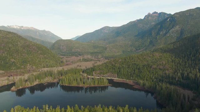 Beautiful Aerial Panoramic View of Larry Lake during a vibrant sunny day. Located on the West Coast of Vancouver Island near Tofino and Ucluelet, British Columbia, Canada.
