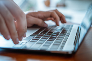 Fototapeta na wymiar A male Hands typing on notebook laptop