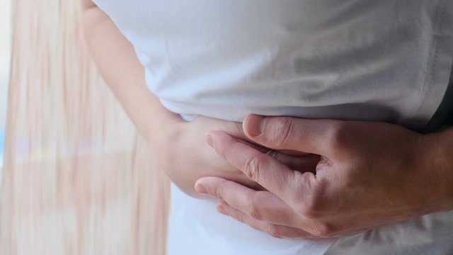 Man with stomach pain, gastritis symptom, peptic ulcer, pancreatitis