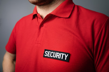 closeup of security service guard uniform badge