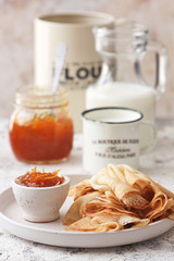Traditional Ukrainian or Russian pancakes with orange jam
