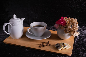 a cup of coffee stand on a tray.