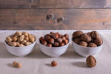 different nuts stand on the table.