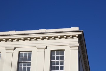Fototapeta na wymiar Traditional white building against deep blue sky