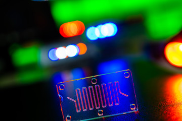 Organ-on-a-chip (OOC) - microfluidic device chip that simulates biological organs that is type of artificial organ. Prototype of design lab-on-a-chip in microfluidic laboratory