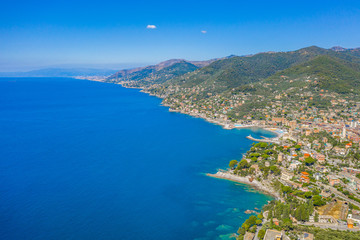 Fototapeta na wymiar Rocky bay in Italy. Aerial drone view on Adriatic sea beach, Camogli, liguria.