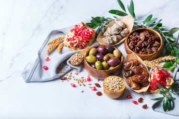 Tu Bishvat holiday symbols - dried fruits, pomegranate, barley, wheat