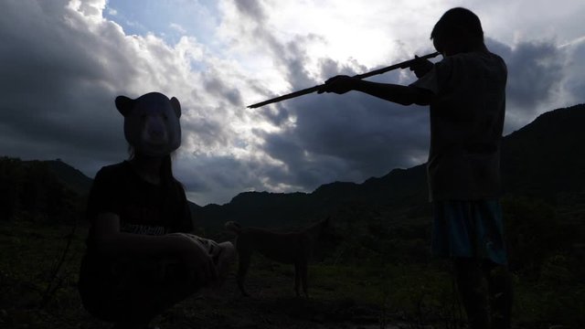 Boy With Gun Hunting Boy Wearing Animal Mask