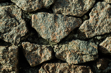 Brick wall of an old building. The structure of the stone. Brickwork. Stone wall.