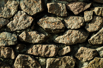 Brick wall of an old building. The structure of the stone. Brickwork. Stone wall.