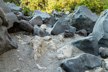 View with Mountain river and big stones on  ground. Gorge of Alcantara on island Sicily in Italy. Nature landscape scene.