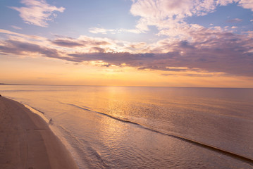 Fototapeta na wymiar Beautiful sunset sky with clouds over Baltic sea beach coastline. Jurmala. Latvia.