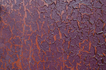 Peeling paint on an old door. Old peeled wall.