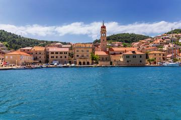 Fototapeta na wymiar Pucisca is small town on Island of Brac, popular touristic destination on Adriatic sea, Croatia. Pucisca town Island of Brac. Adriatic coast town Pucisca.