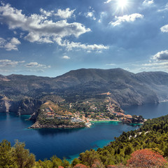 Fototapeta premium Wonderful summer seascape of Ionian Sea. Wonderful place for holiday. Amazing Greece. Picturesque colorful village Assos in Kefalonia. Turquoise colored bay in Mediterranean sea. Aerial view.