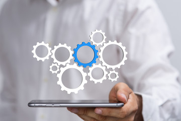 Business, Internet and technology concept. Business select gear icon on virtual screen.