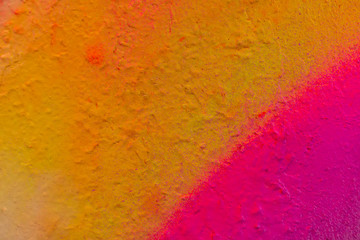 Beautiful bright colorful street art graffiti background. Abstract creative spray drawing fashion colors on the walls of the city. Urban Culture, pink , red , orange , yellow, green, purple texture