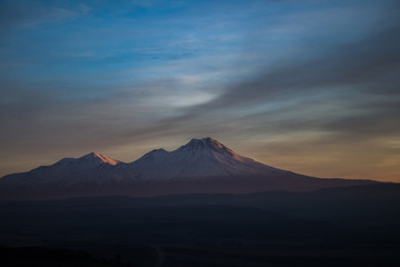Fototapeta premium Snowy Mount Hasan Volcano Anatolia Turkey Aksaray Sunset Pink Red Orange Sky
