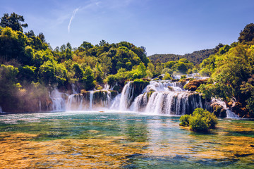 Beautiful Skradinski Buk Waterfall In Krka National Park, Dalmatia, Croatia, Europe. The magical waterfalls of Krka National Park, Split. An incredible place to visit near Split, Croatia. - obrazy, fototapety, plakaty