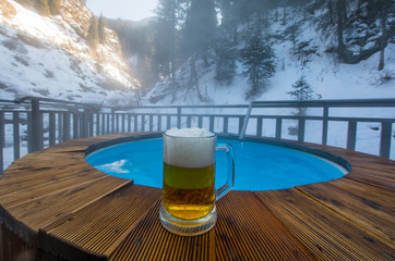 beer mug, thermal pool in the mountains in winter