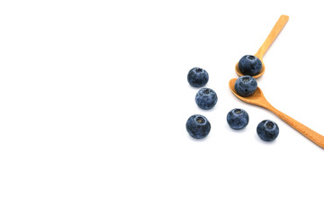 group of blueburry fruit on wooden spoon. Isolated on white background. copy space for text.