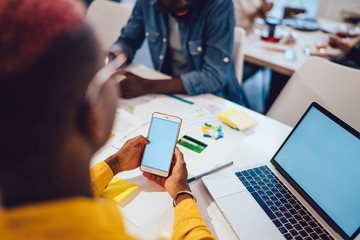 Woman using modern gadgets during cooperation with partner