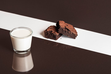 Chocolate brownies cake and glass of milk. Chocolate dessert