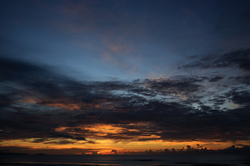 Fototapeta na wymiar Seascape with a vibrant sunset over a calm sea