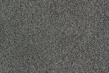 Uniform waterproofed building construction floor and stone gravel roofs. Textured colored gravel background.