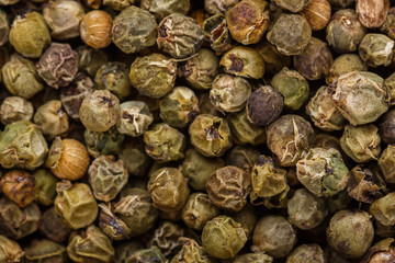 spicy green peppers on white acrylic background