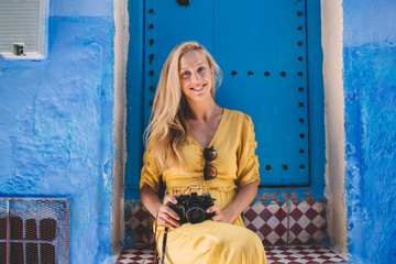 Smiling photographer near old building