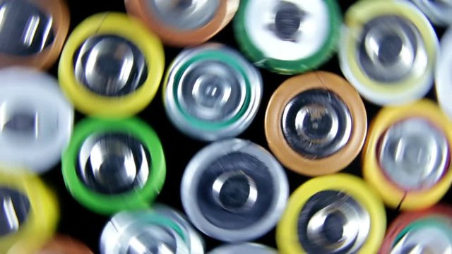 Different types of used batteries in heap. High danger for the environment. Batteries background