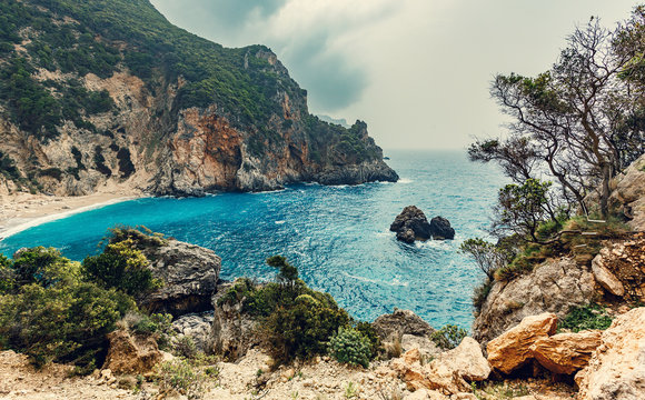 Beautiful view over the sea beach in Kerkyra island. Wonderful morning seascape of Ionian Sea, Corfu island. Aerial summer view of Giali Beach. Greece, Europe. Awesome nature landscape.