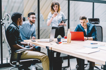 Diverse colleagues working on project together