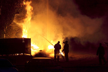 Fire of garbage and trees near a rural Park