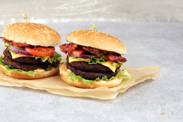 Tasty fresh meat burgers with salad and cheese. Homemade angus burger.
