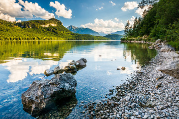 Coastline in Altausseer lake, distant Dachstein - Powered by Adobe